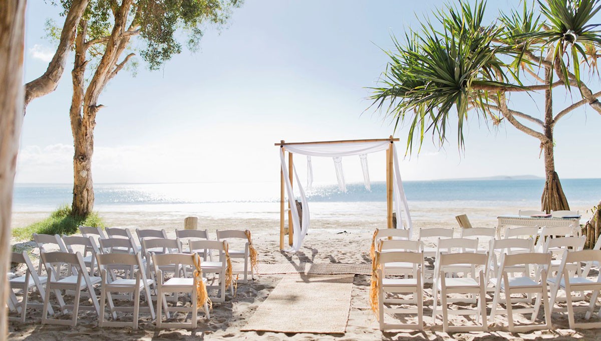 Honeymoon Island beach wedding arch with Gulf horizon