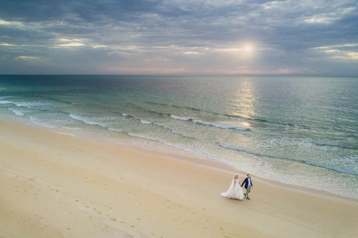 Siesta Key wedding arch on powder-soft white sand at sunset